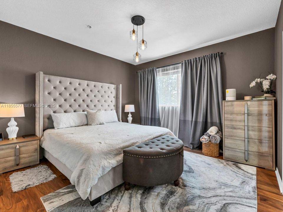 Main bedroom with 2 closets and built ins.