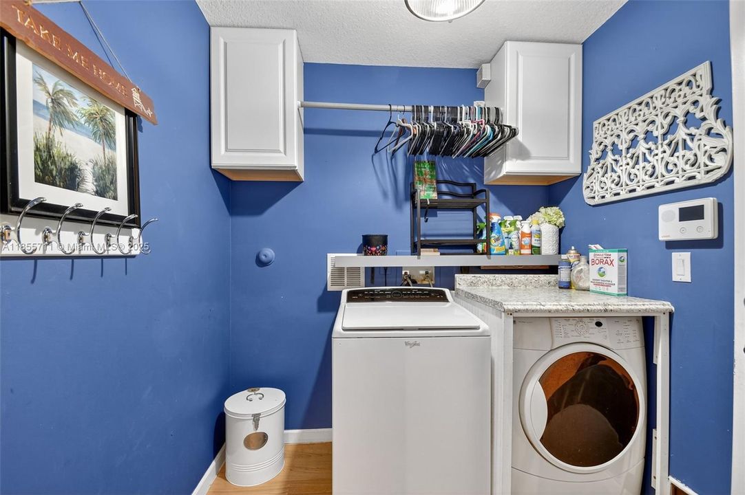 Laundry room with farm doors.