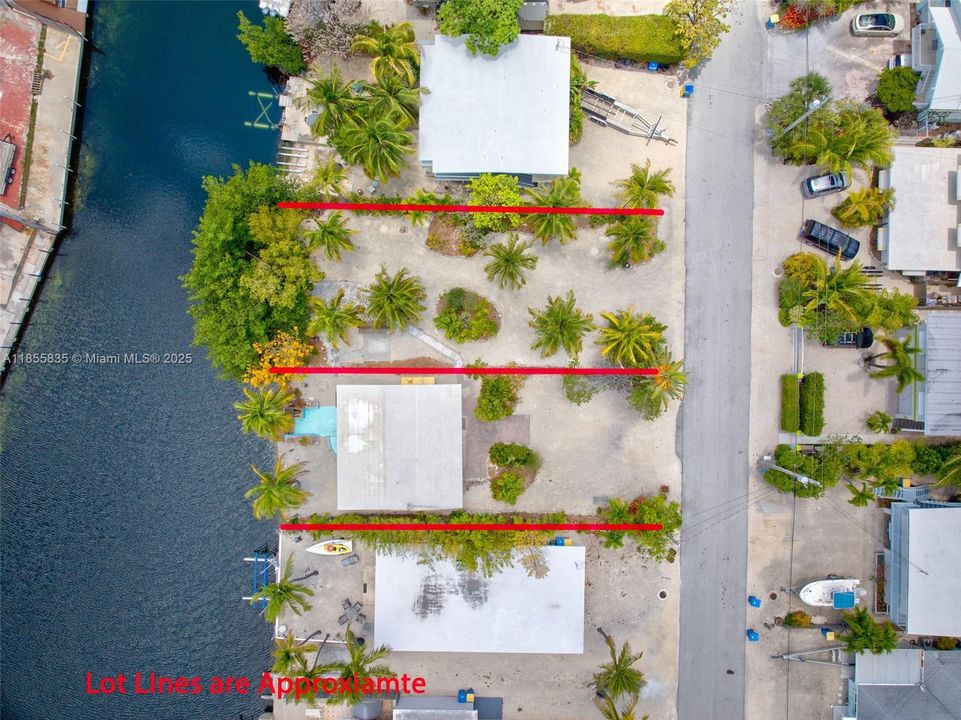 Mangroves on lot 2 in permitting to get trimmed back from the canal to allow for T-dock...inquire about buying the house, or the vacant lot, separately...