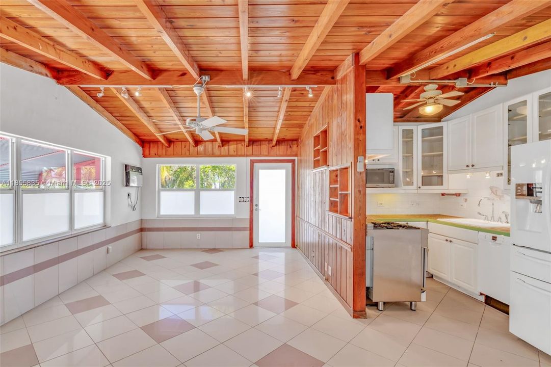 Compact kitchen area open to the great room, easy to reconfigure to include a bar seating area with seating