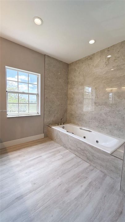 Oversized tub for soaking and relaxing and unwinding at the end of a long day.