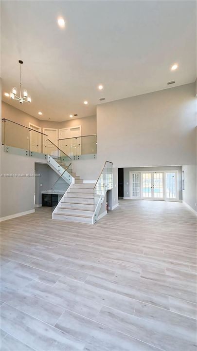 Beautiful new glass staircase welcome you to the second level of the home.