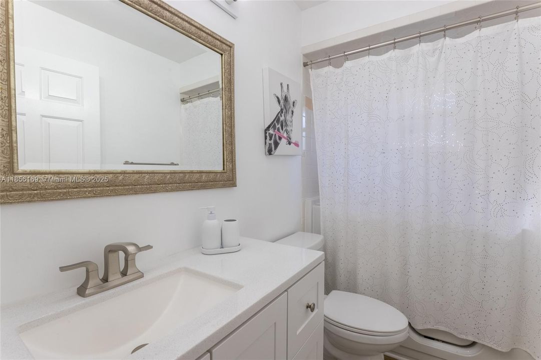 Guest bathroom has a very expensive walk-in tub