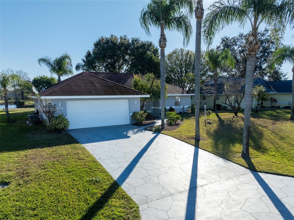 Driveway leads to a 2 car garage