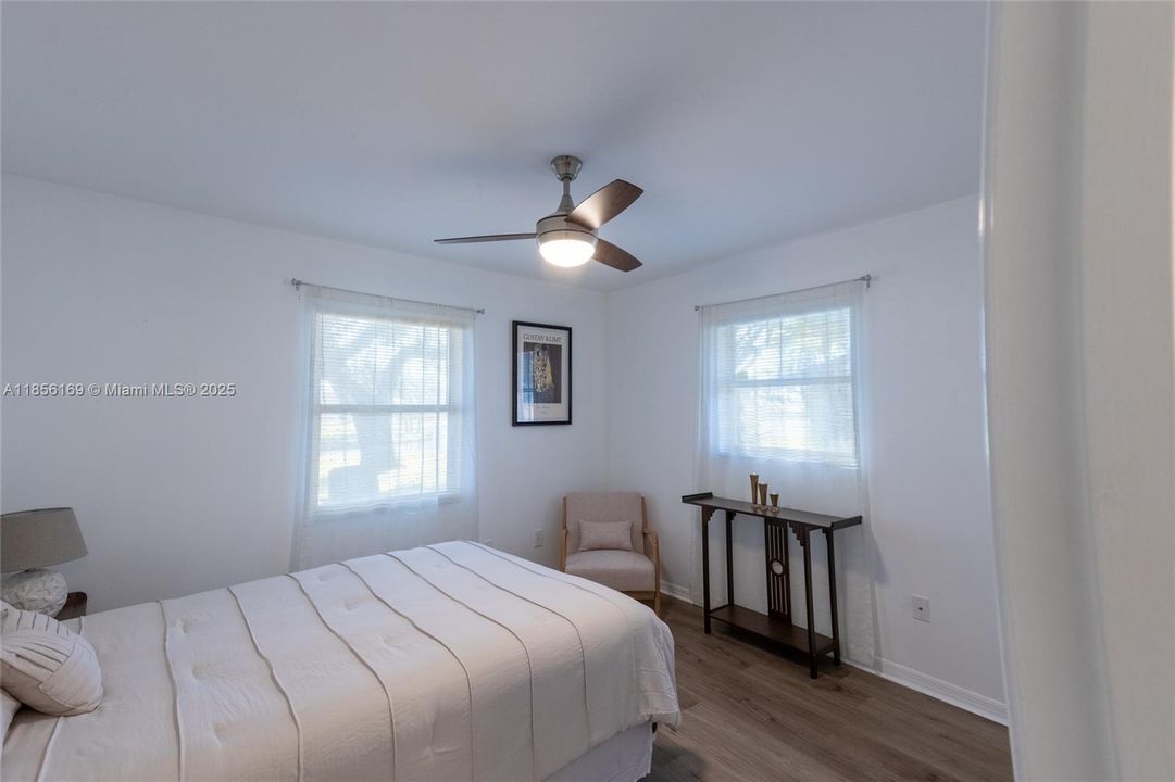 Corner guest bedroom overlooking the lake