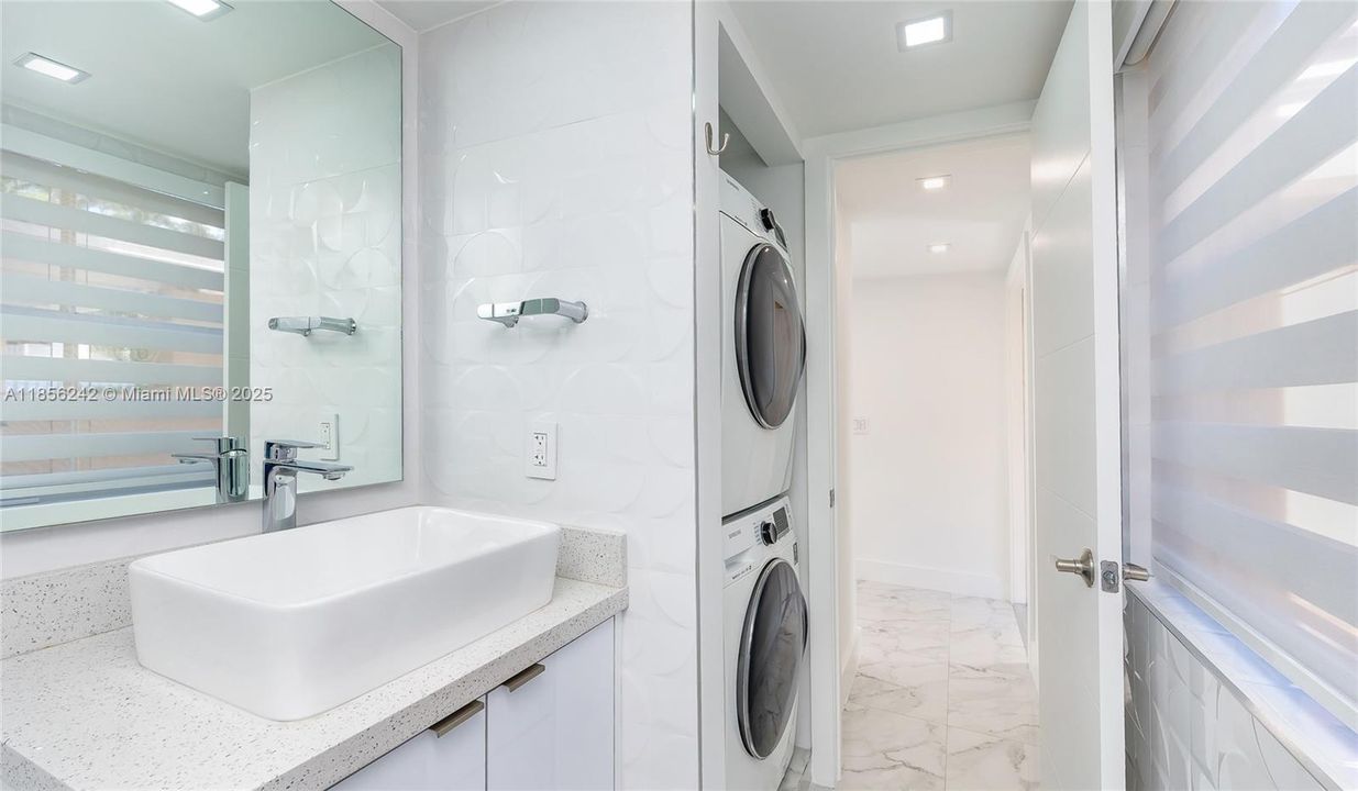 Half Bath with full-size front-load Washer & Dryer