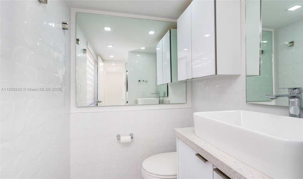 Half Bath with full-size front-load Washer & Dryer