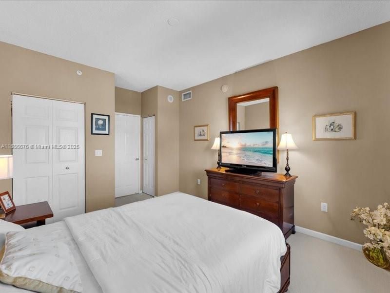 Main Bedroom with great furniture, inviting for a good night's sleep.651 Okeechobee Blvd., Unit #1002, West Palm Beach, FL.  City Place Tower Condominium. For Sale.