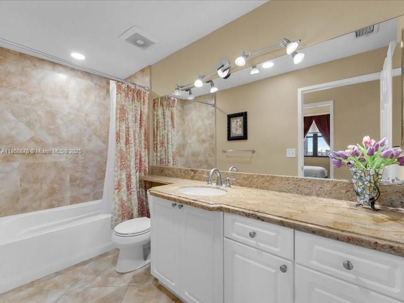 Updated Bathroom with shower/tub combination.651 Okeechobee Blvd., Unit #1002, West Palm Beach, FL.  City Place Tower Condominium. For Sale.