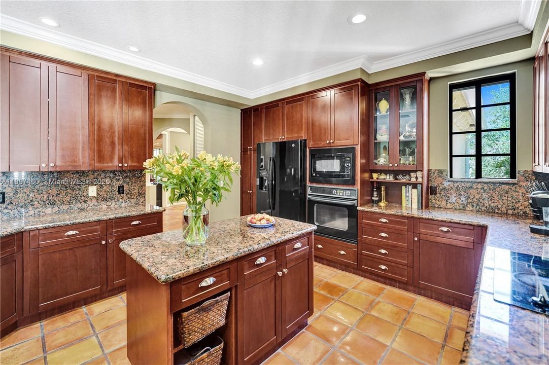 Custom kitchen with cabinets to the ceiling