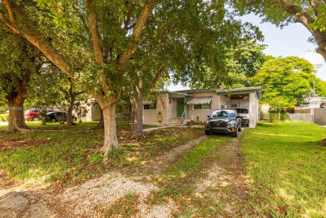 CARPORT COULD BE ENCLOSED FOR EXTRA LIVING SPACE