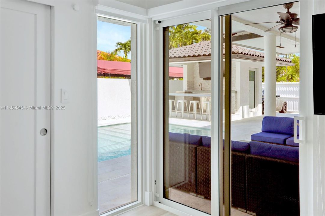 Bedroom 1 with view to the pool/possible in law quarters with outdoor access