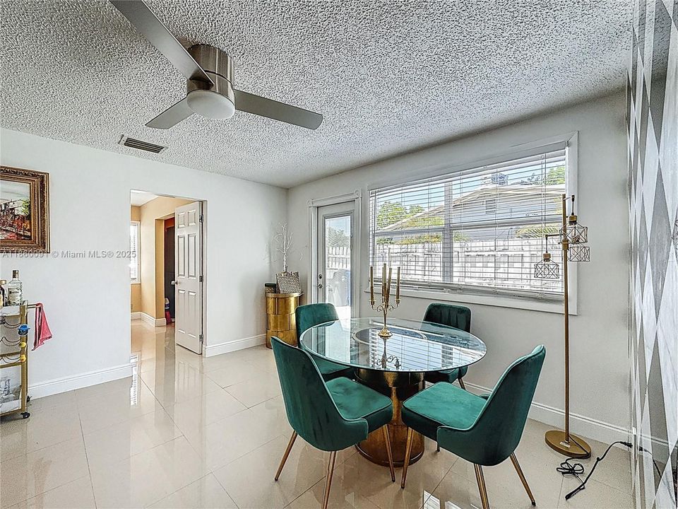 Emerald Green and Gold Appointed Living Room
