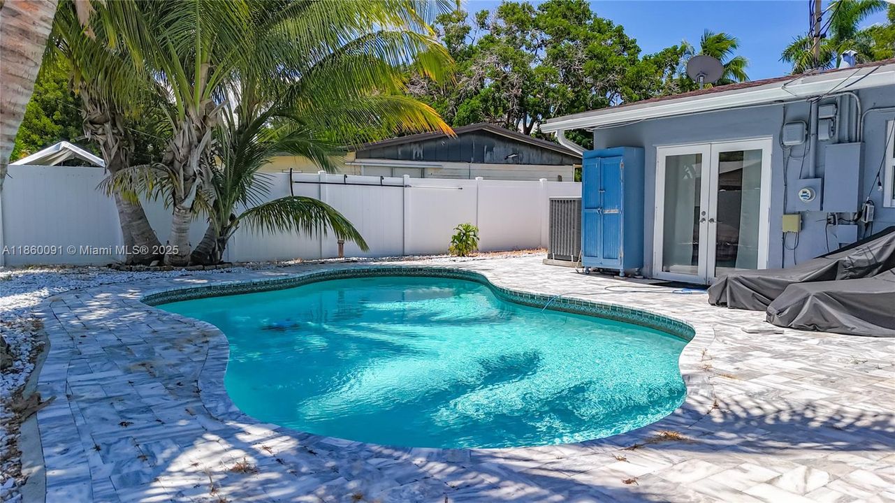 HEATED POOL WITH MARBLE PAVERS