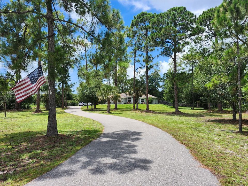 View of entrance to the property via the long driveway.