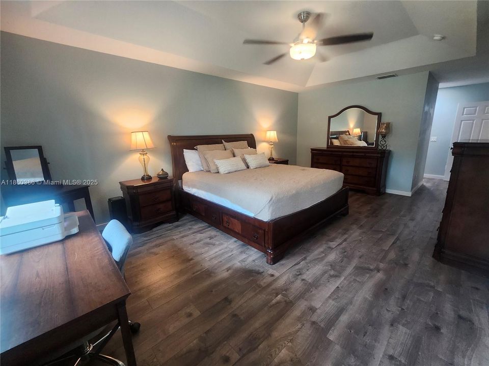 Spacious Primary Bedroom with En-suite Bath and 2 Walk-in Closets (His & Hers).