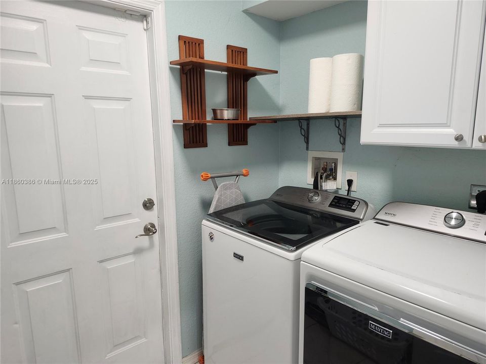 Laundry room leading to the 2 car garage.