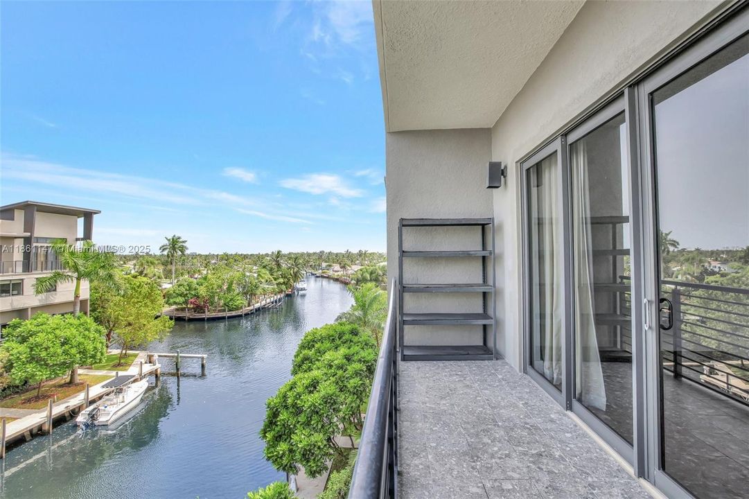 long views down the canal from your fourth floor primary bedroom balcony.