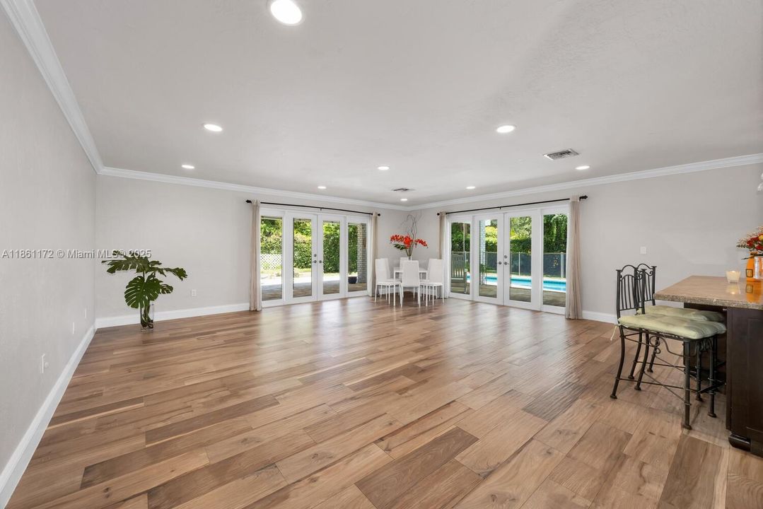 Open Concept . Living room with dining area.  Kitchen island on the right