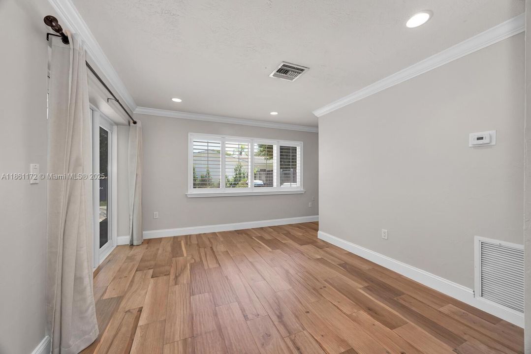 Family room with French doors leading to the pool patio