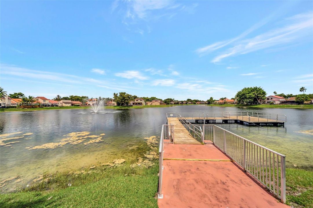 Scenic lake with fountain views and a community dock — perfect for peaceful walks, sunsets, and quiet time by the water.