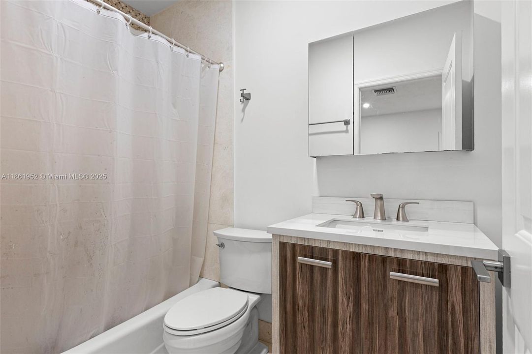 Bathroom located in converted garage.