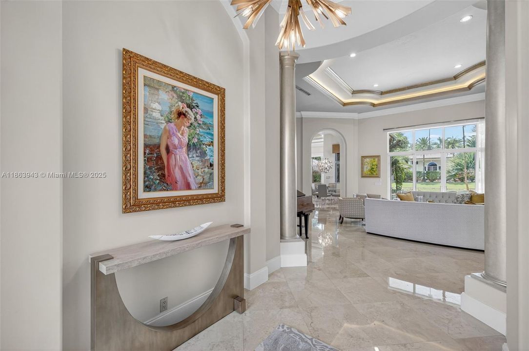 olume ceilings, elegant finishes, and natural light set the tone for this custom estate.