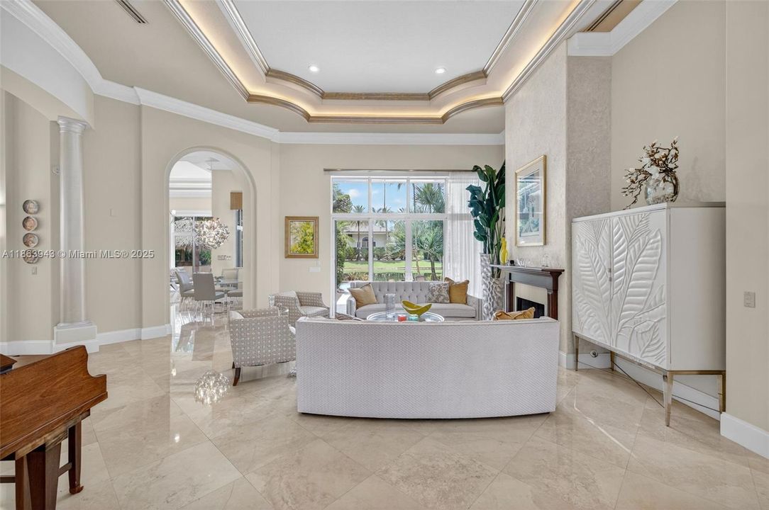 olume ceilings, elegant finishes, and natural light set the tone for this custom estate.