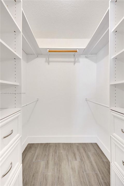 WALK-IN CLOSET PRIMARY BEDROOM