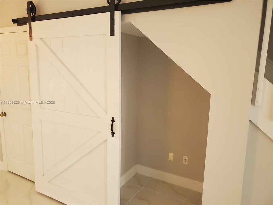 Storage under stairs.