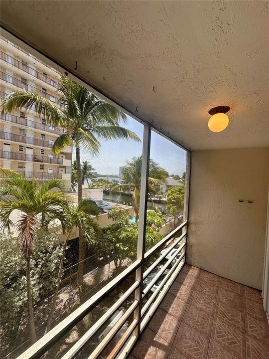 Screened balcony with accordion shutters
