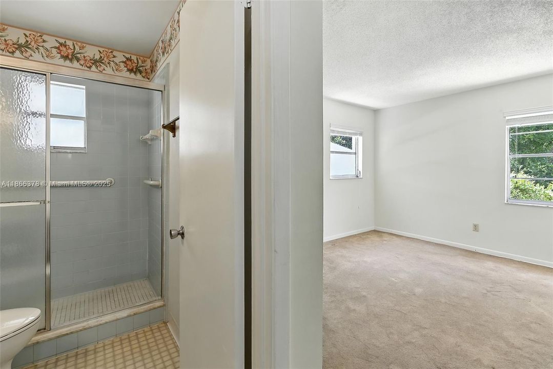 Primary bathroom / view to primary bedroom