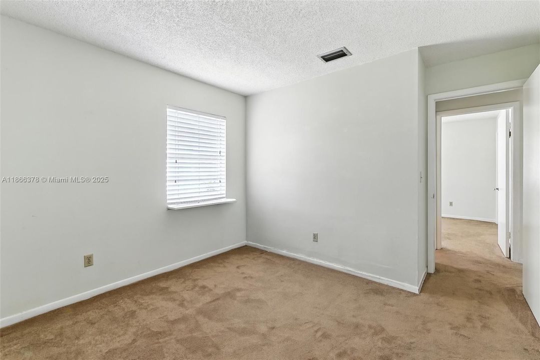 2nd bedroom and view to 3rd bedroom