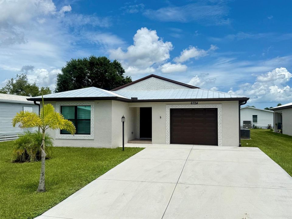 Extended driveway - Metal Roof