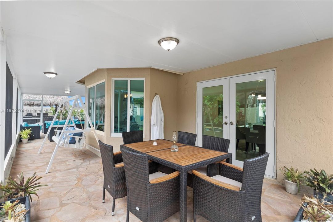 screened in patio with dining and outdoor seating