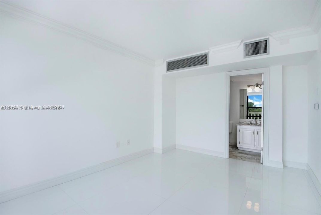 2nd bedroom in- suite with large balcony doors