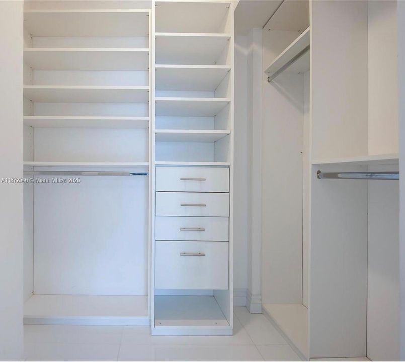 2 Master walking closets and white linen closet