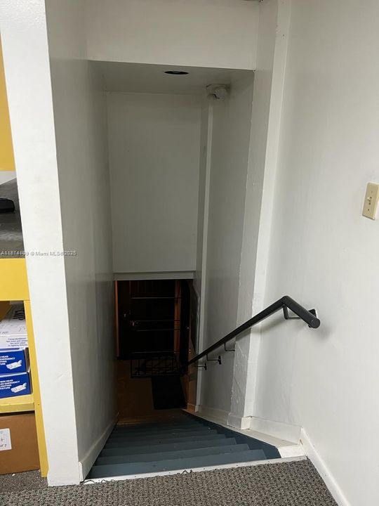 back staircase to warehouse area
