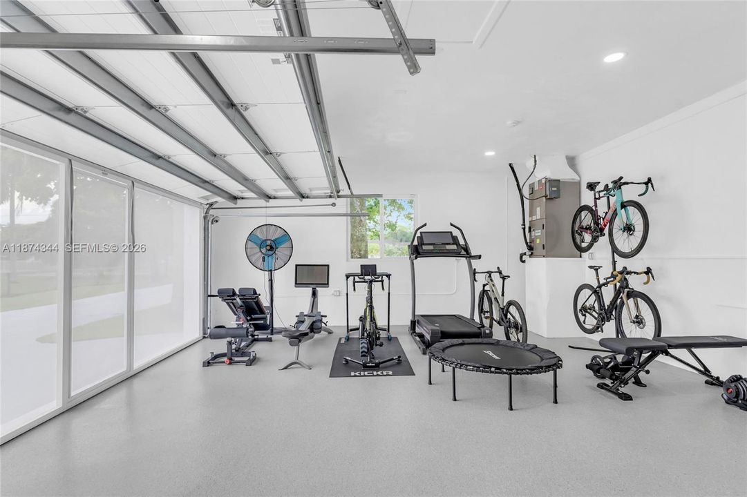 Impact door with secondary screen door to enclose but allow for inside/outside use