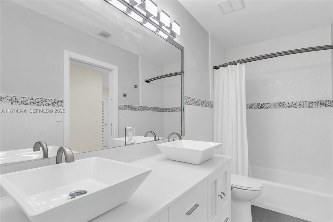 Hallway bathroom with pool access