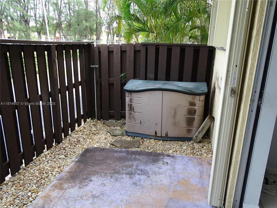 Private patio with access to the street or parking area.