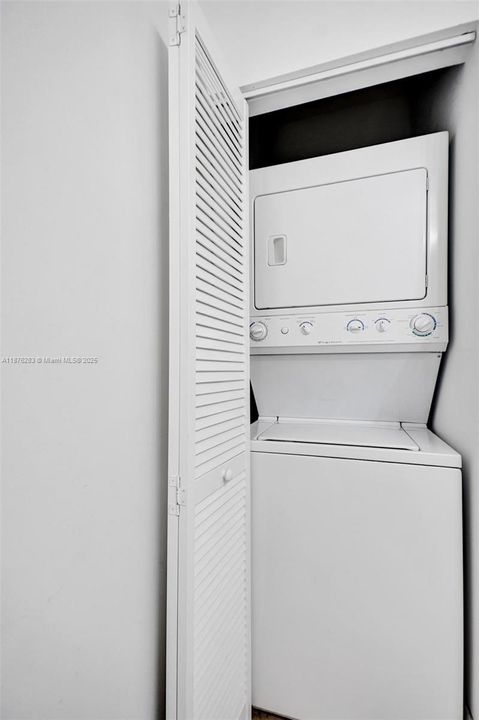 In-unit washer and dryer for your convenience, discreetly tucked away behind louvered doors.