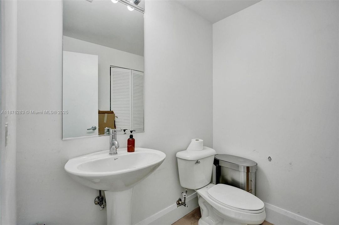 Rare feature in a one-bedroom condo — a convenient guest half-bath that adds comfort and functionality.