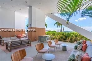 Beautifully designed outdoor lounge areas with stylish seating and tropical landscaping — ideal for relaxing or socializing.