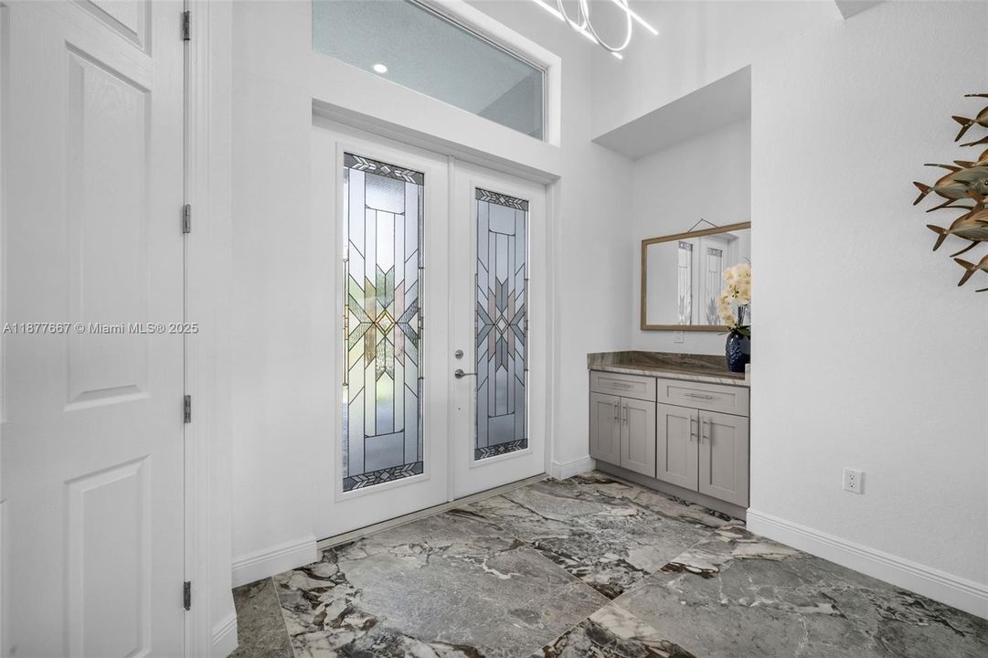 Elegant stained-glass French doors at entry