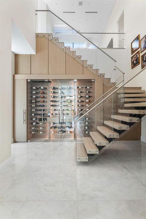 Wine room and glass-railed staircase