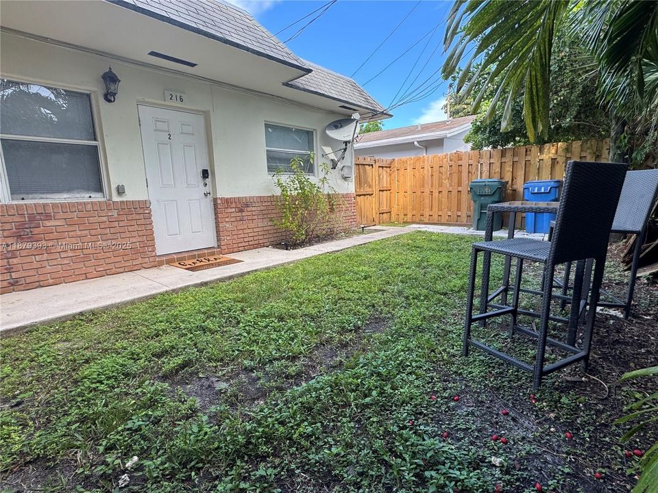 Table w/chairs area. Room for a puppy, sunbathing or a BBQ