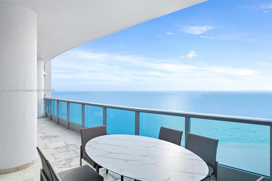 Enjoy a meal with friends and family from your ocean front terrace.