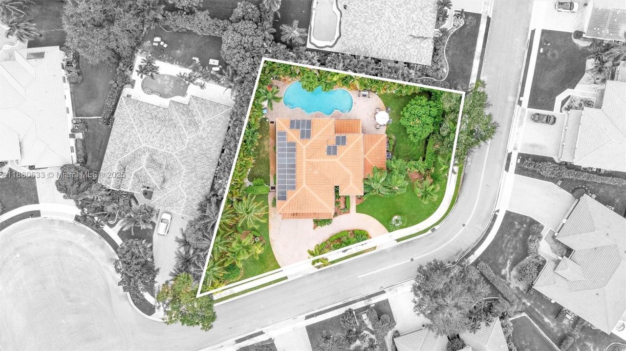 oversized corner lot within an exclusive private gated community.