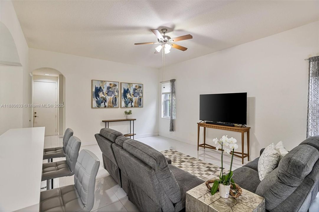 Family area with natural light and overlooking to the kitchen and pool